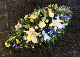 Blue, Yellow and White Casket Spray