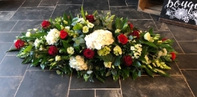 Mixed Casket Spray Red Green and White
